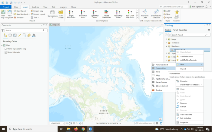 A screenshot showing ArcGIS Pro, with menus open showing a new feature class about to added to a geodatabase.