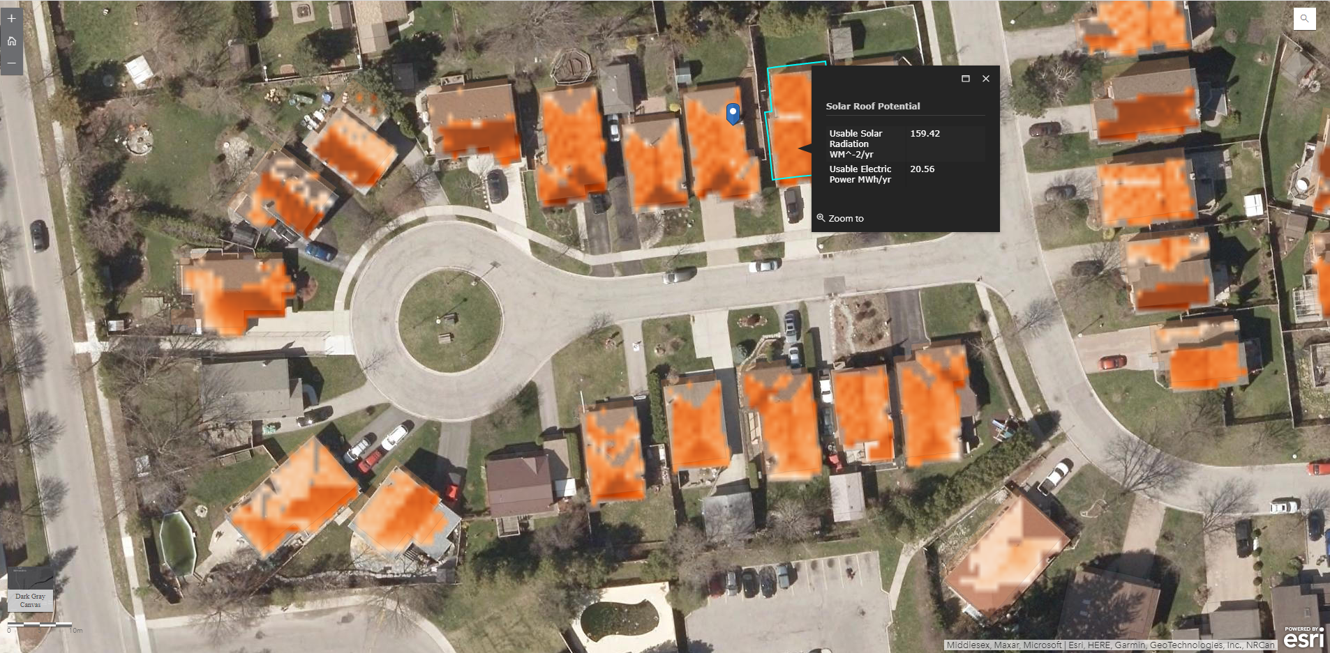 Zoomed-in screenshot of the webmap, with aerial photography as the basemap, and a formatted popup displaying usable solar radiation and electric power estimates for a selected rooftop.